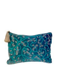 A blue and green floral patterned toiletry bag with a beige zipper pull.