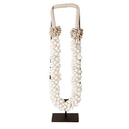 A decorative shell necklace with a natural, organic appearance. The necklace features a rope-like cord and is adorned with clusters of small, white shells.