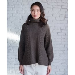 Cozy brown sweater with a high collar and long sleeves, perfect for layering during the colder months.