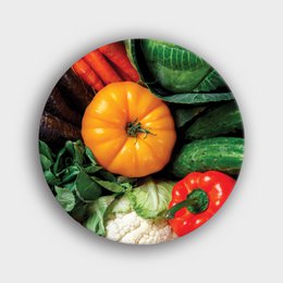  A round wall circle featuring a vibrant display of fresh vegetables, including a large orange pumpkin, green leaves, and red peppers. The circle is a decorative piece that can be used to add a rustic, farmhouse-inspired touch to any room.