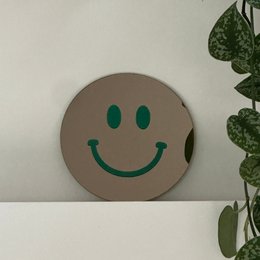 Det lille mørkegrønne smil