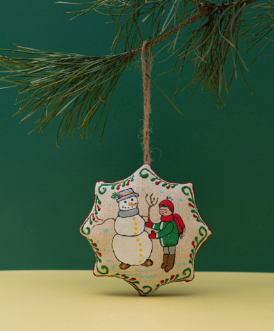 Kerstster "Jongen maakt sneeuwpop"