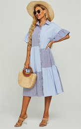 Relaxed striped print dress in blue and navy color block, with short sleeves and a midi length.