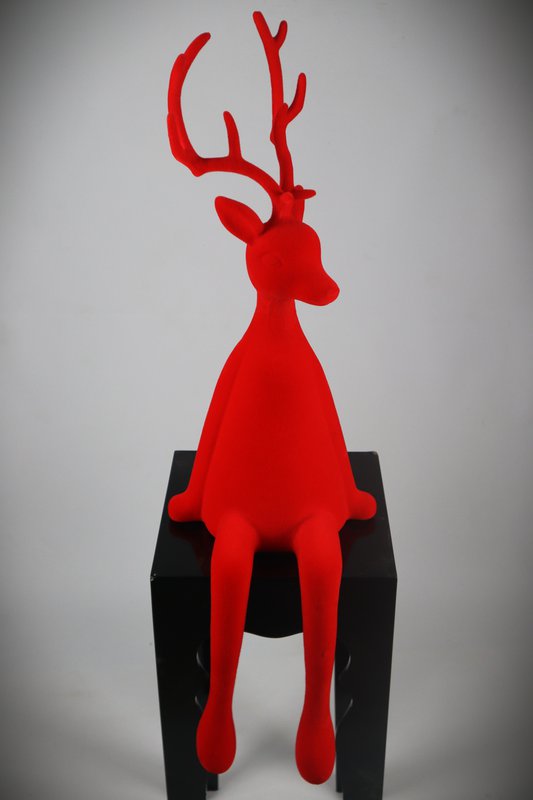 Reindeer sitting red flock plastic. 93cm PU:1