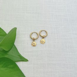 15mm, 11mm, and 20mm gold-tone hoop earrings with a dangle charm for a touch of sunshine.