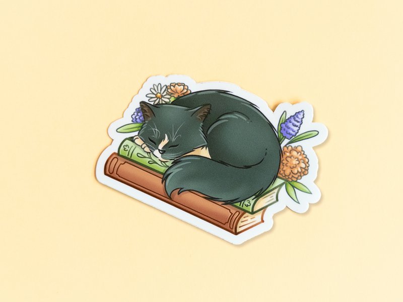Cat on books sticker