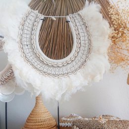 Decorative necklace with feathers and shells