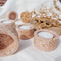 Cork tealight holder, natural beige speckled material, round cylindrical shape, minimalist design, set of multiple holders.