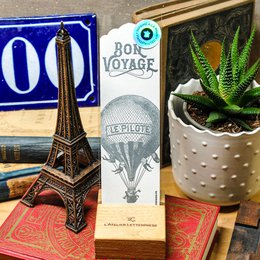 Letterpress bookmark with hot air balloon design, suitable for travel-themed books or gifts.