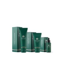 A luxurious skincare gift set featuring high-quality moisturizing creams and serums in a sleek, green packaging.