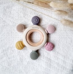 Multicolor teething toy with various shapes and textures for baby's dental development.