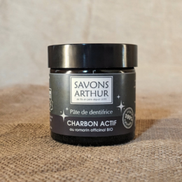 Activated charcoal toothpaste with organic rosemary for natural dental care.