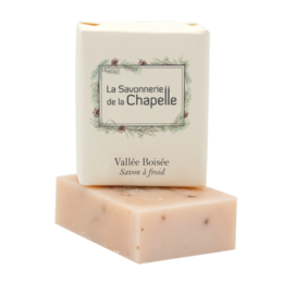 Handcrafted soap bar with a natural, earthy scent. Made with high-quality ingredients including shea butter and essential oils. Rectangular shape with a textured surface.