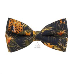 Floral and animal print bow tie with coral accents, suitable for formal or casual wear.