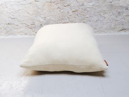 Square, brown pouf ottoman with a soft, plush texture.