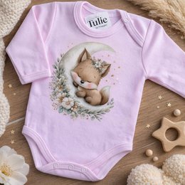 Soft pink baby bodysuit with sleeping fox illustration, floral wreath, gentle dreamy design.