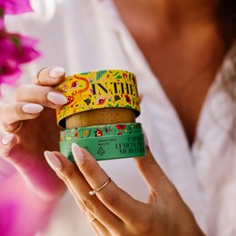 Oily face moisturizer with Vitamin E, in cream form, with yellow and green packaging featuring text and graphics.