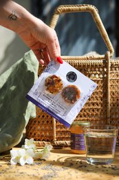 Lavender honey tea bombs with hibiscus, pink, lavender, and chamomile flavors. Includes a tea infuser and tea bags.