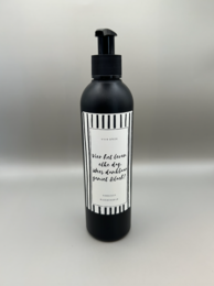 Hand soap with a celebratory message, featuring a black and white label design.