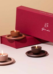 "Set of 3 round shallow tea light holders, burgundy and rose gold metallic finishes, modern minimalist design"