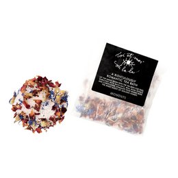 A fragrant and indulgent tea bath bag filled with a blend of dried rose petals, lavender, and other natural ingredients, creating a relaxing and rejuvenating bathing experience.