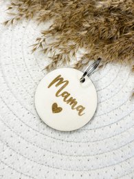 Wooden keychain with "Mama" text, round shape, natural materials.