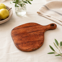 Rustic wooden cutting board, acacia wood, round paddle shape, natural brown finish, kitchen serving board.