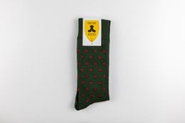 Green socks with red polka dots pattern. Made of high-quality material for comfort and durability.