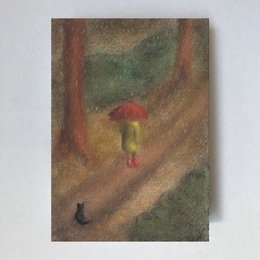 A whimsical Waldorf-style card depicting a person walking in the rain with an umbrella, surrounded by a forest scene with a black cat in the foreground.