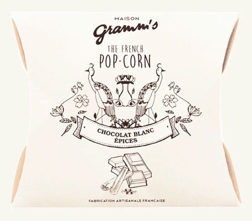 Æsker med karamel pop-corn overtrukket med hvid chokolade og krydderier (30g)