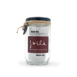  A glass jar with a black lid and label that says "Viola". The jar contains a clear liquid, likely a beverage or spirit.