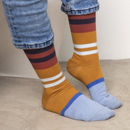 Colorful striped socks made in France, featuring a variety of vibrant colors including green, purple, navy, and red.