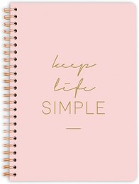 A simple, spiral-bound notebook with a pink cover and the text "Keep Life Simple" printed in gold.