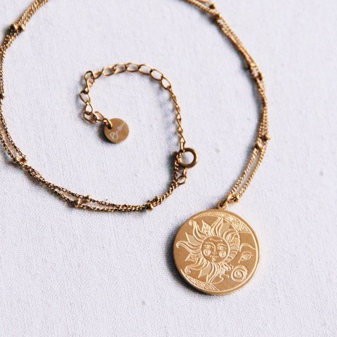 Stainless steel fine chain with balls with moon/sun charm – gold
