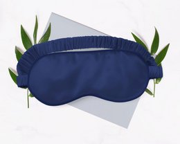 Midnight blue 100% silk sleep mask with adjustable strap for comfortable sleep.