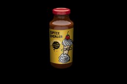 Sweet chili sauce in a glass bottle with a red cap. The label features a graphic of a spice dealer and the text "Spice Dealer - sweet chili sauce".