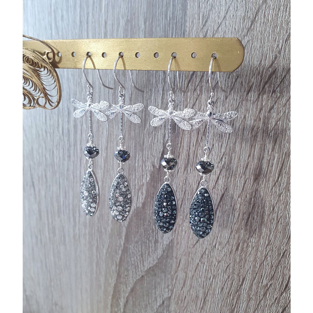 Rhodium plated dragonfly earrings with grey crystal drops