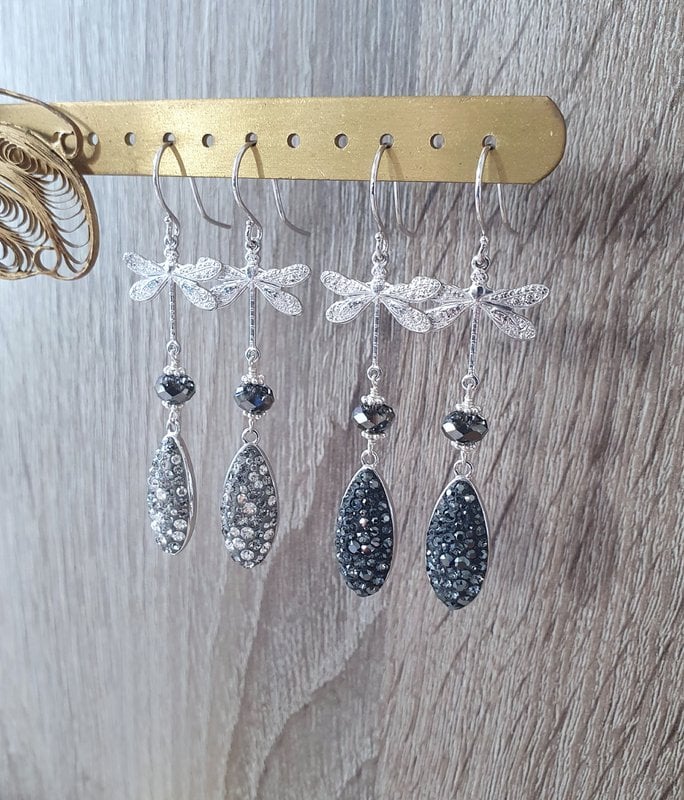 Rhodium plated dragonfly earrings with grey crystal drops