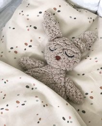  Soft, plush cuddle cloth in the shape of a rabbit with a cozy, textured surface and a neutral color palette.