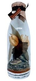 A 1 liter bottle of "Sweet Mint Combawa" rum. The bottle has a decorative label featuring a tropical scene with a palm tree and ocean.