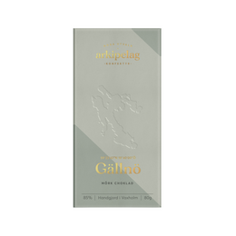 Rectangular chocolate bar with gold text and embossed design on gray packaging.