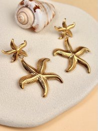Goldene Meer mit hohem Sternohrringen