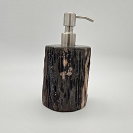Petrified wood soap dispenser with a natural, rustic appearance. Features a stainless steel pump for easy soap dispensing.