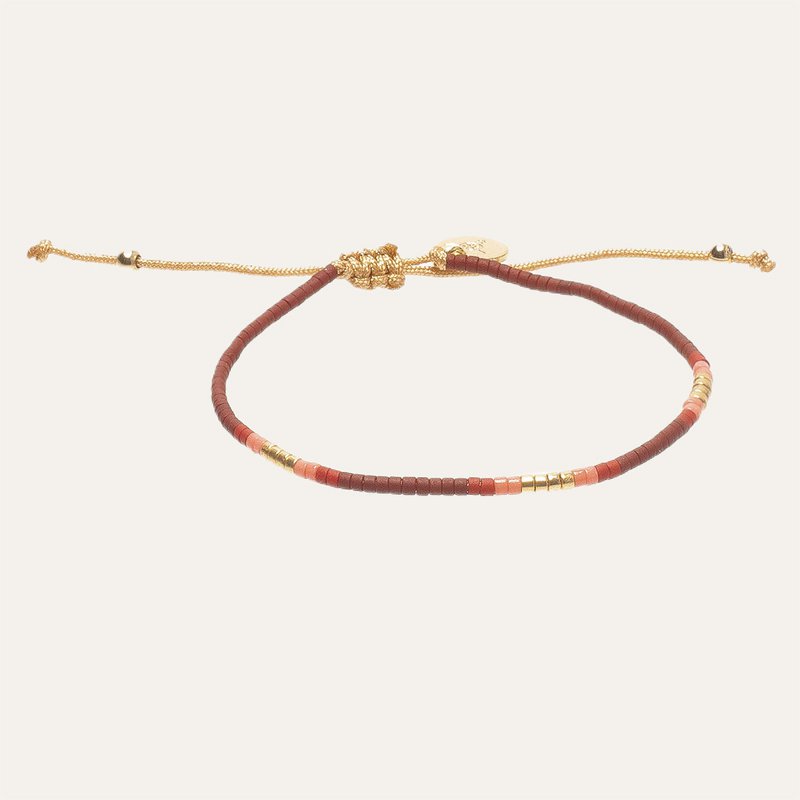 gold bracelet with red