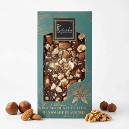 Premium milk chocolate bar with a mix of nuts, including almonds, hazelnuts, and cashews. The chocolate has a rich, creamy texture and a delightful blend of flavors from the various nuts.