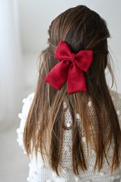 Midi linen hair bows in various colors including bluish grey, white, burgundy red, raspberry pink, dusty pink, beige, deepest black, navy blue, and salmon blush. The bows feature an alligator clip for easy attachment to hair.