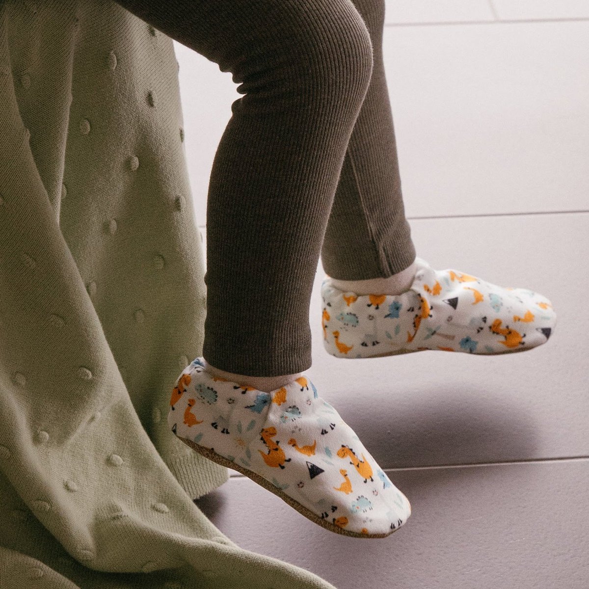 Babyschoenen - gelukkige dino