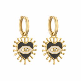 Sunny eyes huggies are drop earrings available in black, pink, peach pink, blue, and soft pink. The earrings feature a sun-shaped design with an eye motif in the center, accented by small rhinestones.