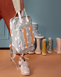  A gray backpack with a hedgehog print, suitable for kids. The backpack has a rectangular shape, adjustable straps, and a zipper closure.