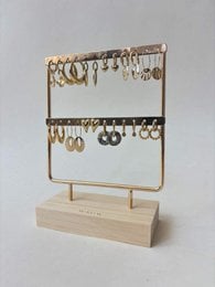 Gold metal jewelry display stand with wooden base, two-tier organizer for earrings and necklaces.